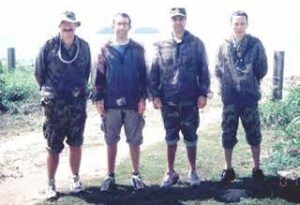 Figure 8: Collaborative investigation with mosquito repellents at Cowley Beach Training Area, Queensland, April 2001. (L to R) Major S. P. Frances (AMI), Dr N. Beebe (UTS) Major M. Debboun (WRAIR, USA), Senior Colonel N.V. Dung (VADMP, Vietnam) preparing to test repellent effectiveness on themselves. 